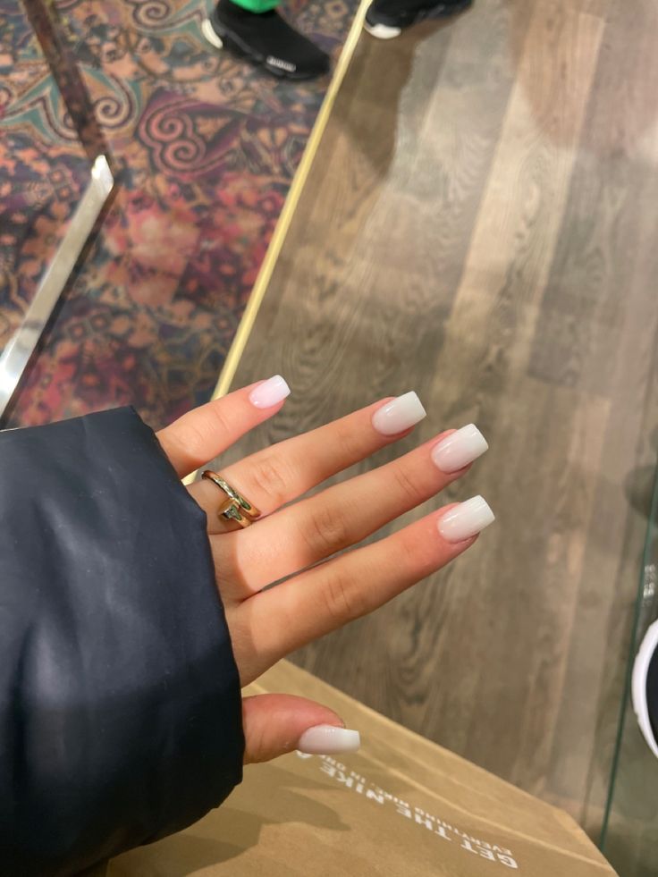 Elegant French Tip Acrylic Nails with Soft Pink Base and Delicate Accessories