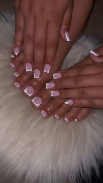 Elegant Soft Pink and White Tip Nail Design with Modern Shapes