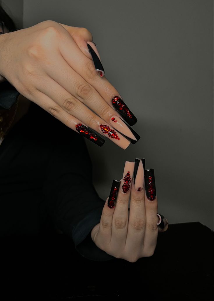 Stunning Matte and Glossy Nail Design with Bold Black Base and Intricate Red Embellishments