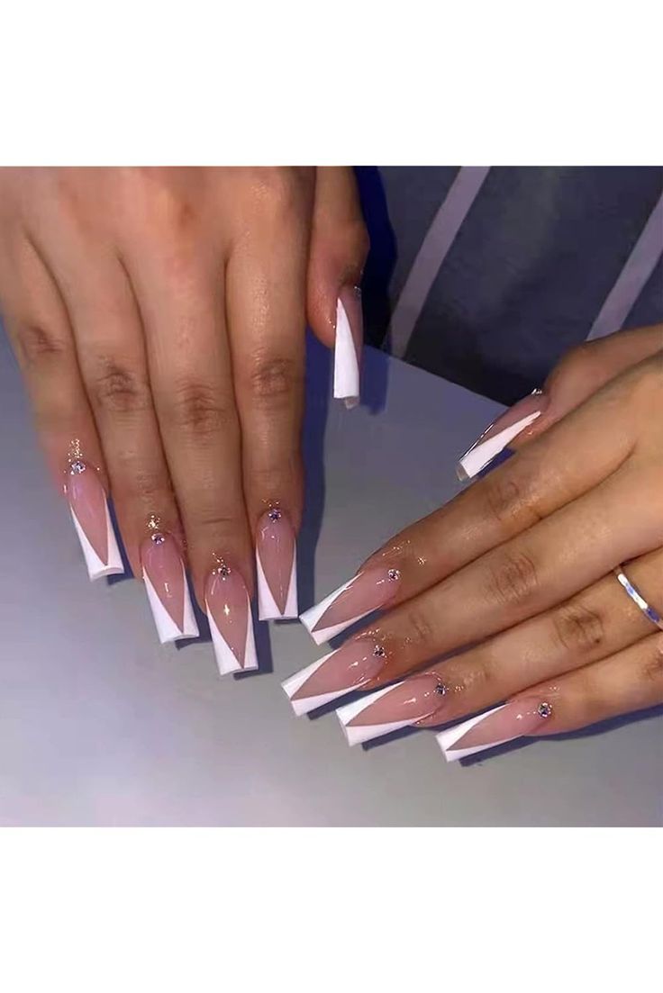 Chic Almond-Shaped Nails with Pink and White Tips Highlight Glamorous Geometric Design.