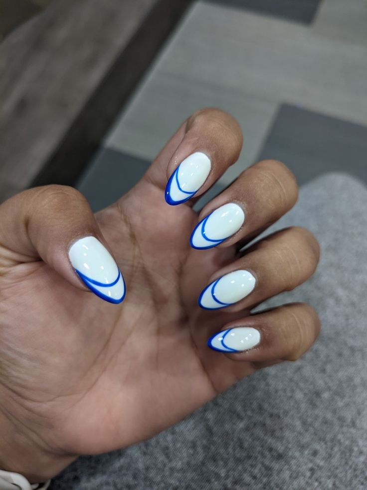 Contemporary Nail Design: Clean White Base with Bold Blue Outlines