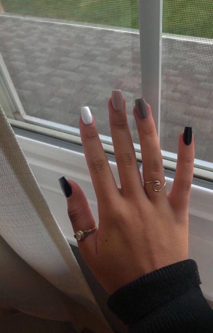 Chic Modern Color-Blocked Nail Design in Black, White, and Grey with Sophisticated Ring Accents