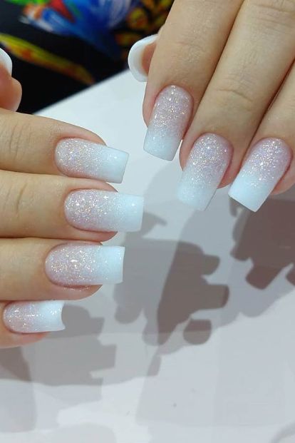 Chic Ombre Nail Design: Glossy Gradient from White to Sparkling Glitter