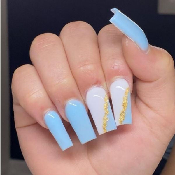 Chic Blue and White Nail Design with Elegant Gold Accents and Unique Shapes.