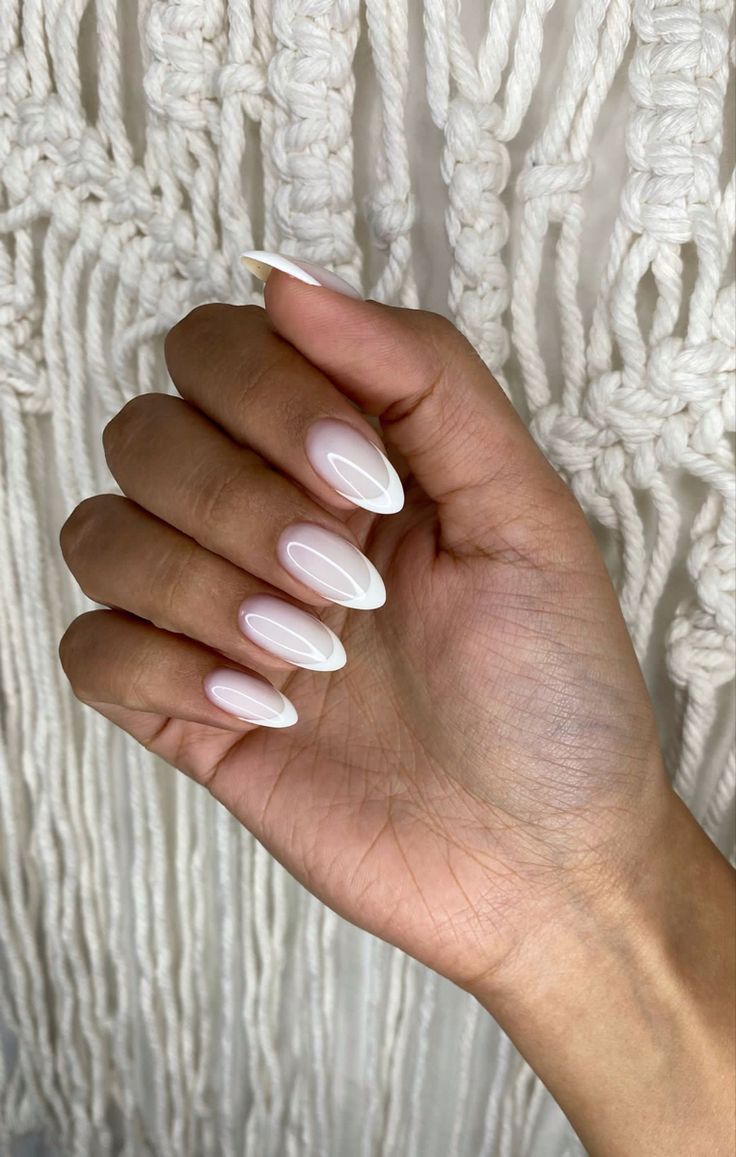 Chic Elegant Almond-Shaped French Manicure with Glossy Nude Base and White Tips.