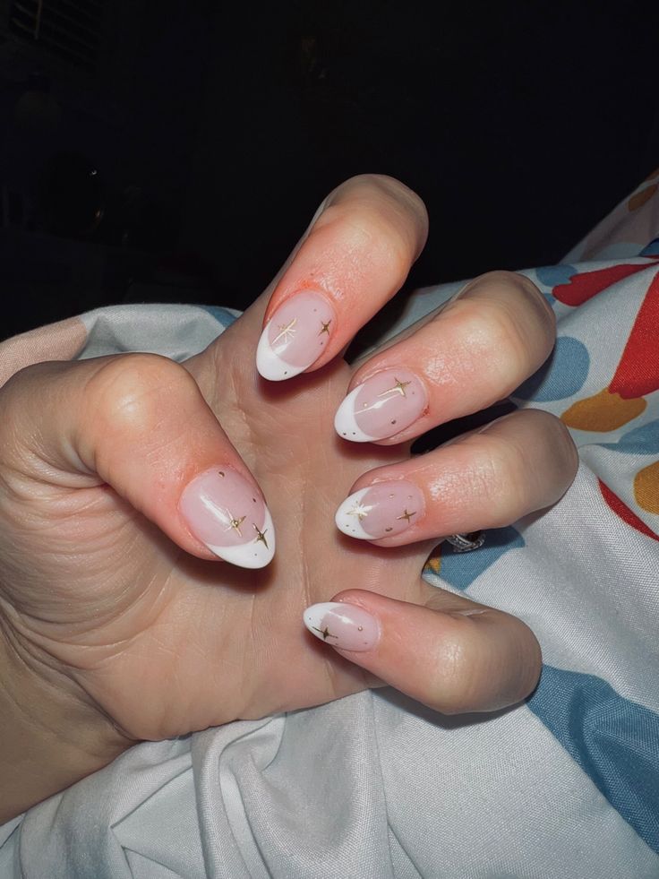 Chic French Tip Nails with Soft Pink Base and Glamorous Gold Accents