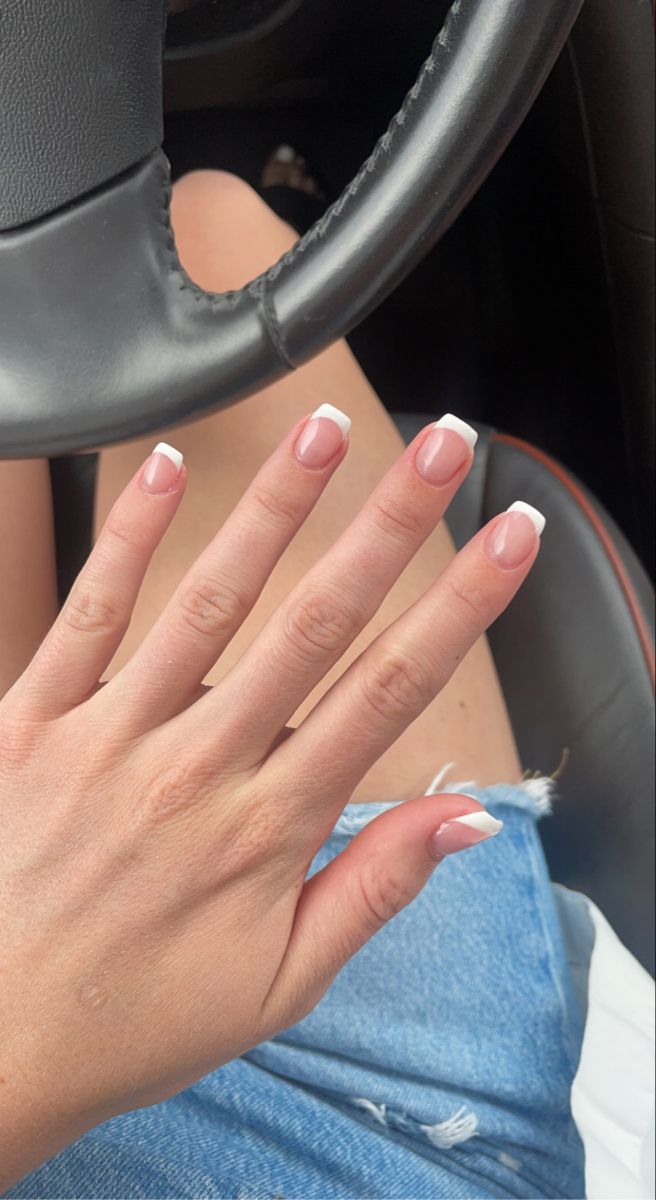 Chic Peachy-Pink Manicure with Classic White Tips: A Timeless and Versatile Design for Any Occasion.