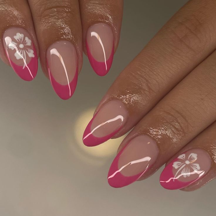 Chic Pink French Tip Nail Design with Floral Accents.