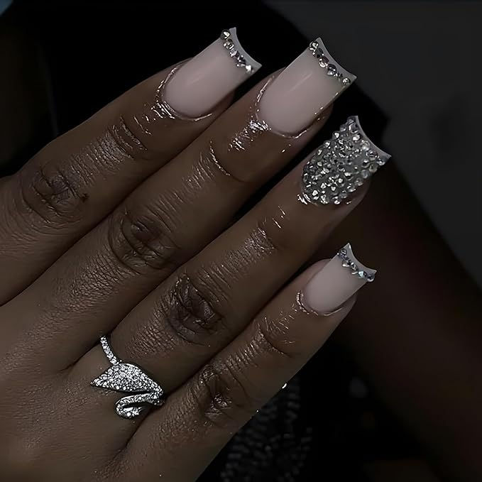 Sophisticated Nude Nail Design Enhanced with Rhinestones and Glamorous Embellishments