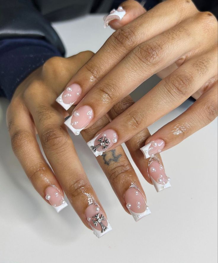 Chic Nude French Manicure with Glossy Finish and Sparkling Embellishments.