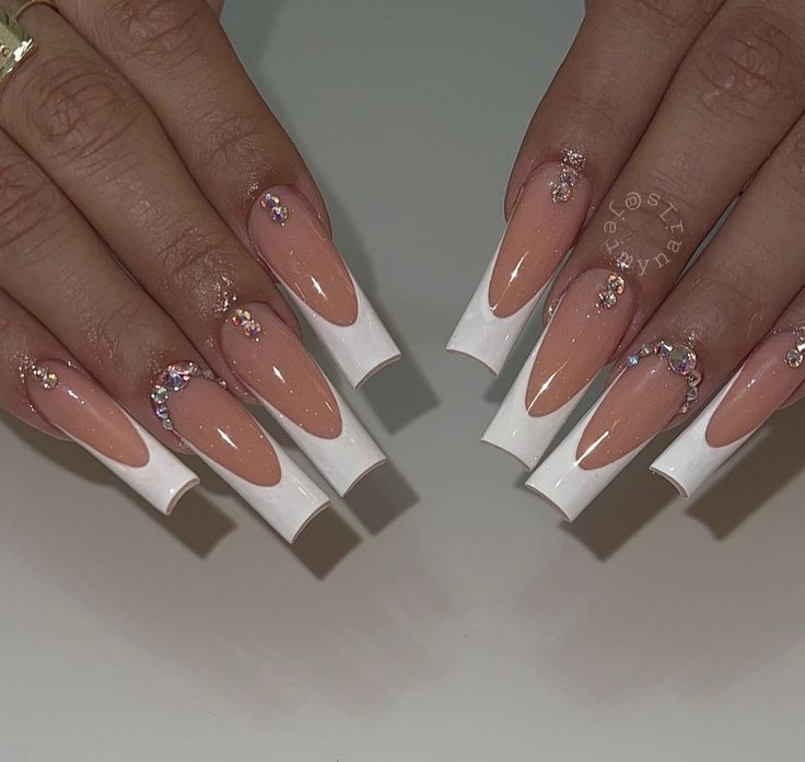 Elegant Long Tapered Nails with Striking White French Tips and Rhinestone Embellishments