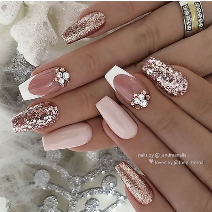 Luxurious Nail Design: Soft Pinks with Rose Gold Accents and Intricate Glitter Patterns.