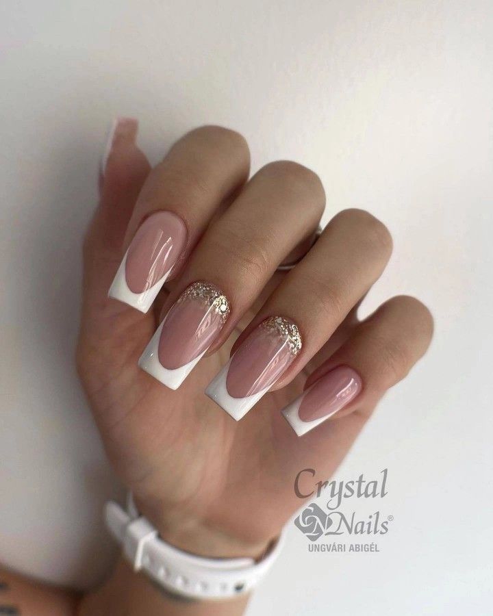 Sophisticated Nail Design: Soft Nude with Glittered French Tips for Every Occasion.