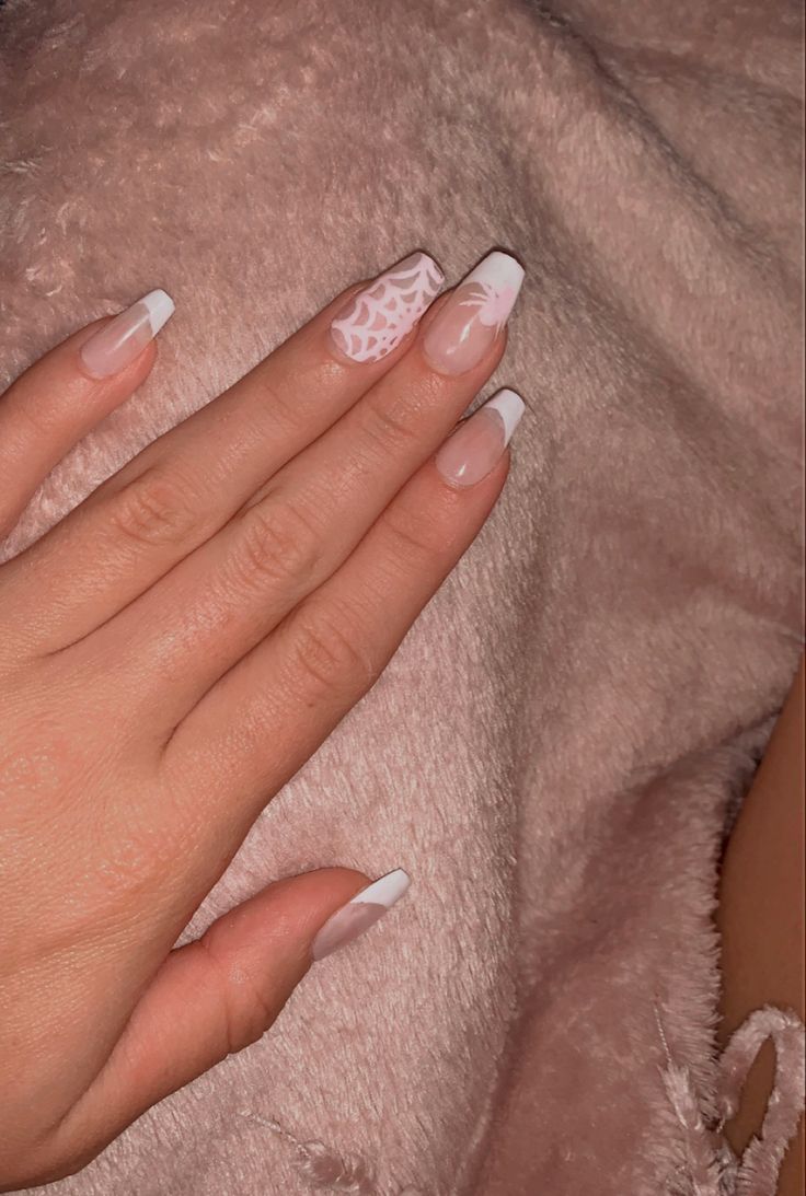 Chic Nail Design: Neutral French Tips with Artistic Patterns for Sophisticated Elegance.