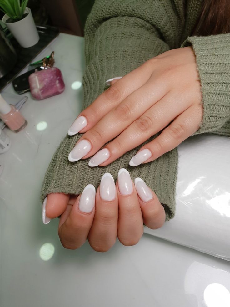 Chic Almond-Shaped White Nail Design for a Stylish and Comfortable Look.