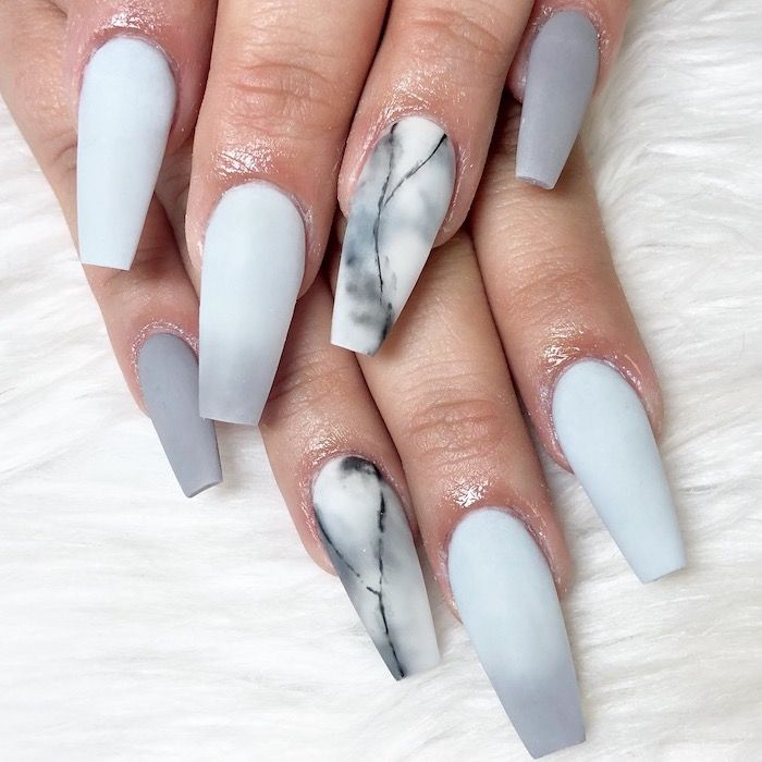 Elegant Matte Gray Nails with Striking Marble Accent for Modern Sophistication.