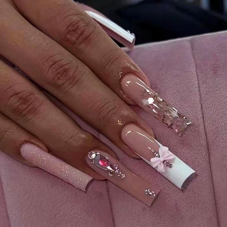 Elegant Soft Pink Square Nail Design with Glossy Finishes and Sparkling Embellishments.