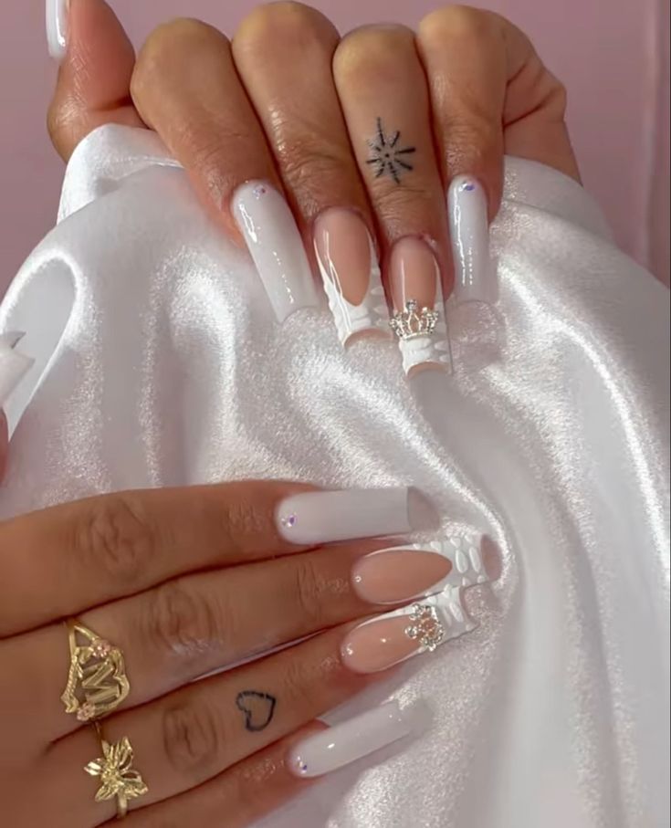 Sophisticated Glam: Long White Acrylic Nails with Intricate Patterns and Jewel Accents