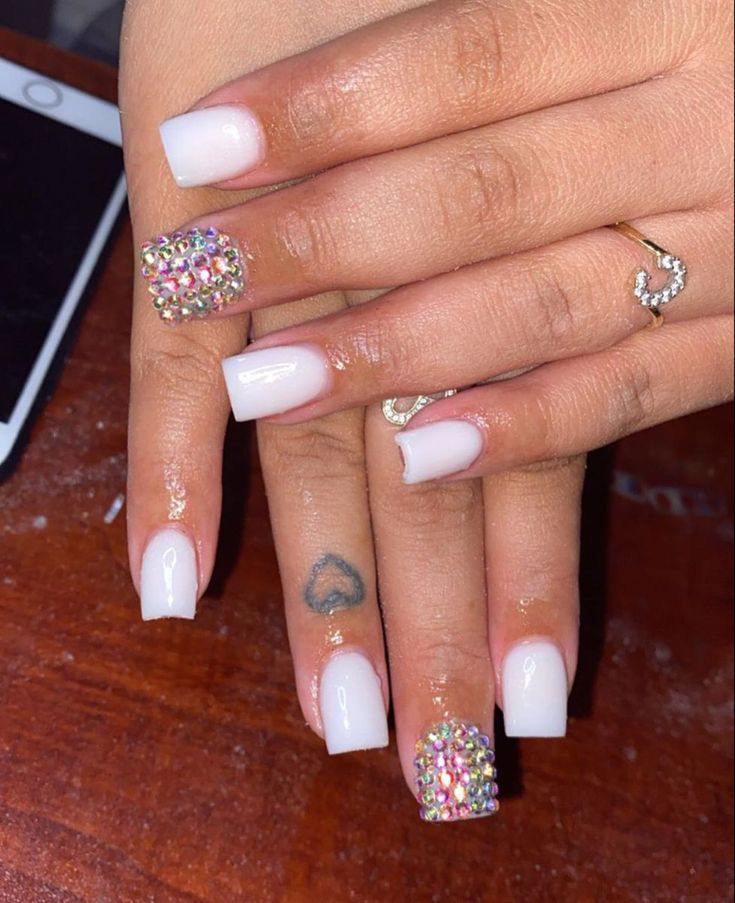 Chic Minimalist Nail Design: Classic White Base with Glamorous Rhinestone Accents