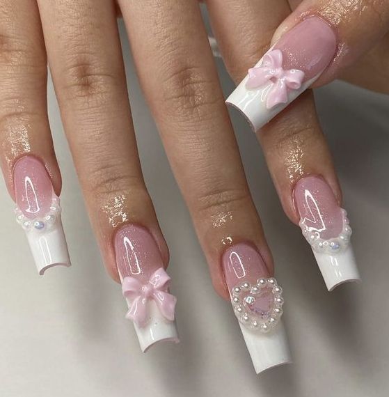 Chic Glossy Nail Design with Soft Pink and White Accents, Bow, and Pearl Details