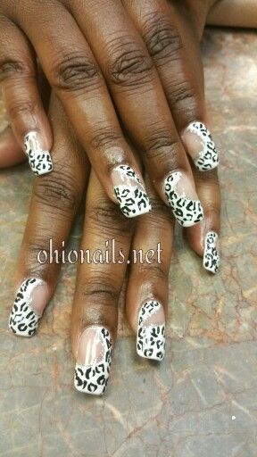 Chic Leopard Print Nail Design: Glossy Finish with Bold Patterns and Elegant Accents