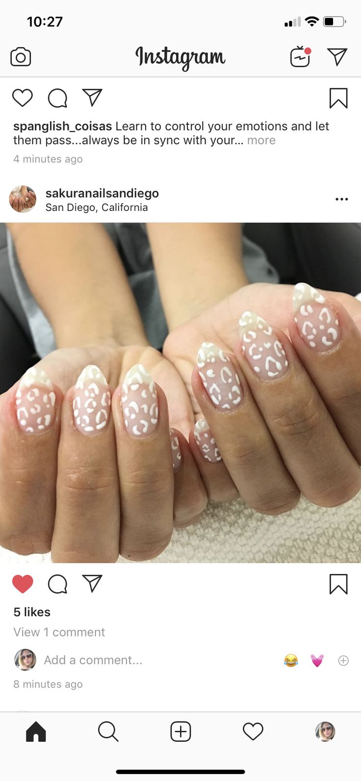 Playful Nude and White Cheetah Print Nail Design with Elegant French Tips.