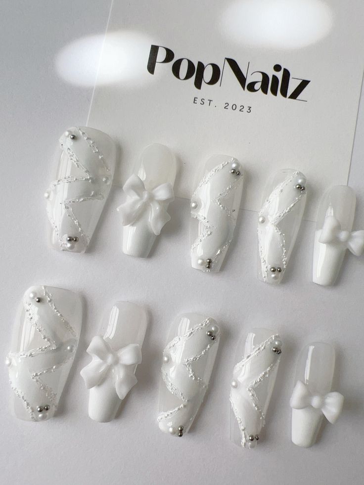 Sophisticated White Nail Designs with Elegant Detailing and Modern Aesthetics.