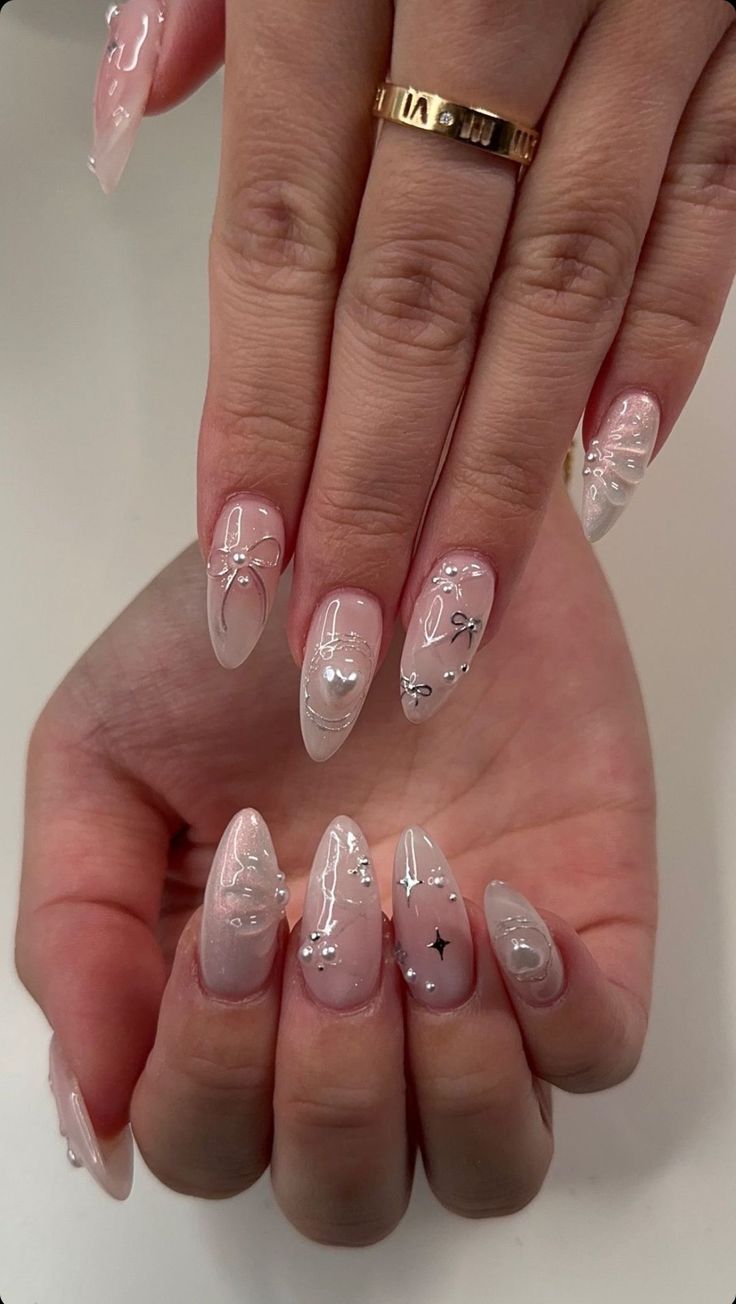 Chic and Playful Nail Design: Soft Pink and Translucent Elegance with Silver Embellishments