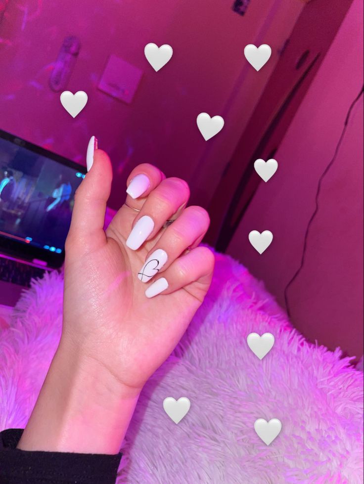 Chic Minimalist Nail Design with Pristine White Polish and Heart Detail