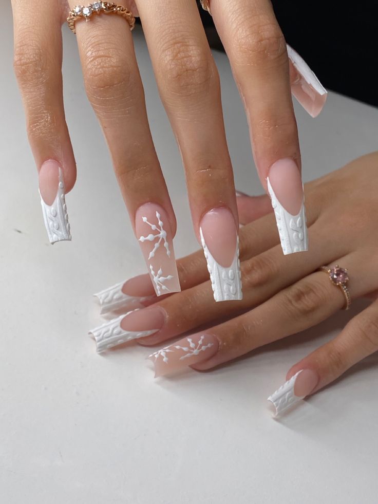 Elegant Pink and White Lace-Inspired Nail Design with Floral Accents.