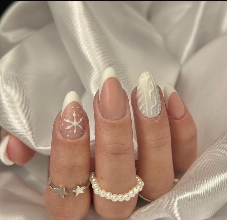 Elegant French Tip Nails with Intricate Designs and Sparkling Embellishments.