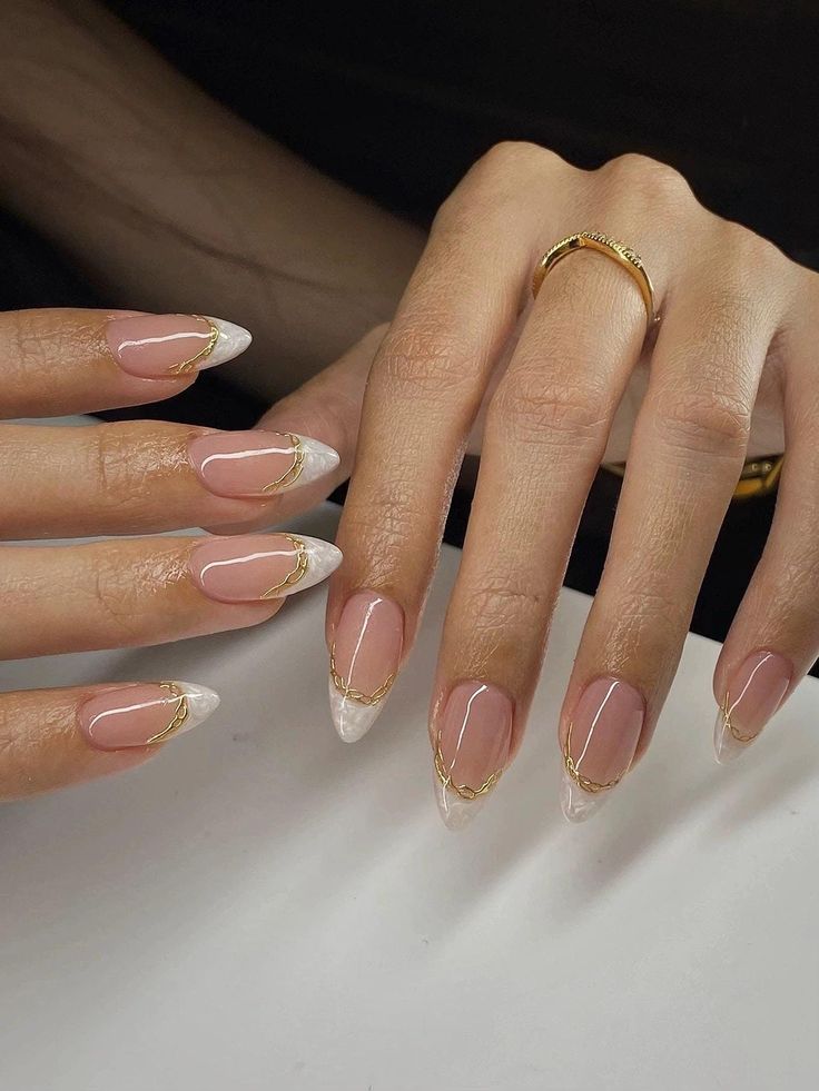 Chic Almond Shaped French Manicure with Nude, White, and Gold Accents.