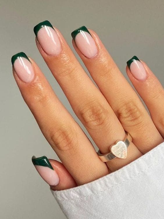 Elegant French Manicure with Rich Green Tips and Soft Nude Base.