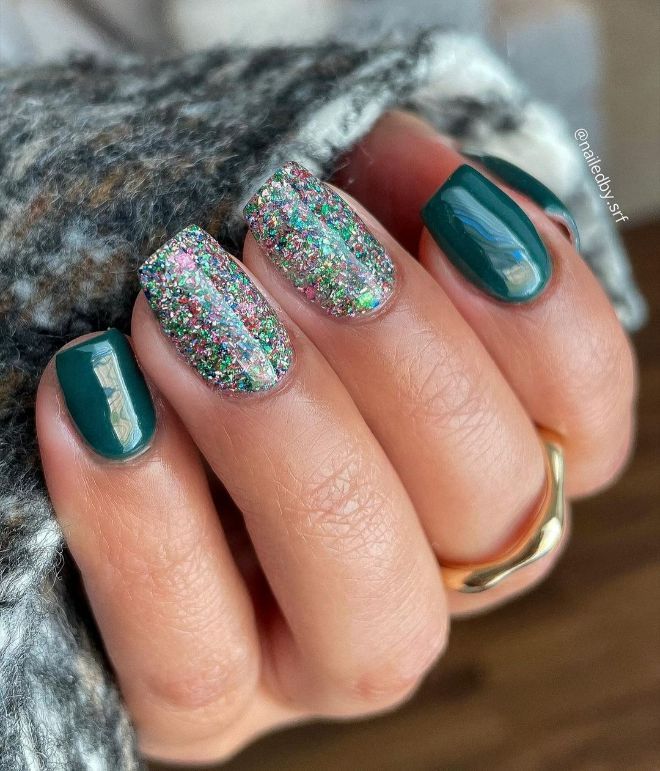 Elegant Deep Green Nail Design with Sparkling Glitter Accents for Eye-Catching Appeal.