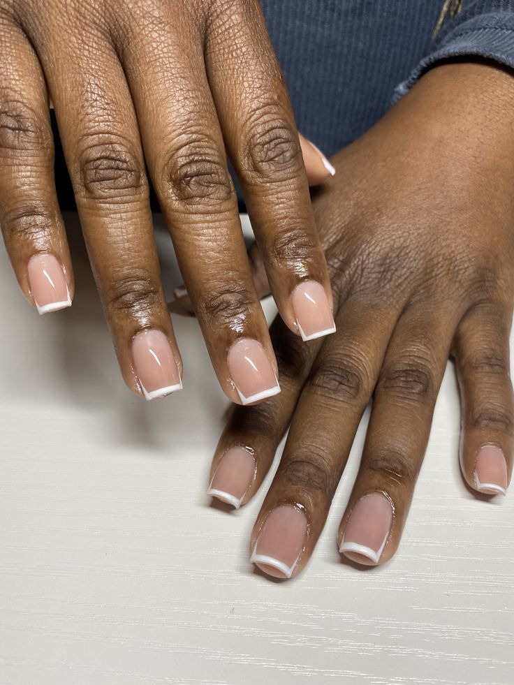 Chic French Manicure: Elegant Nude Base with Glossy White Tips for Any Occasion.