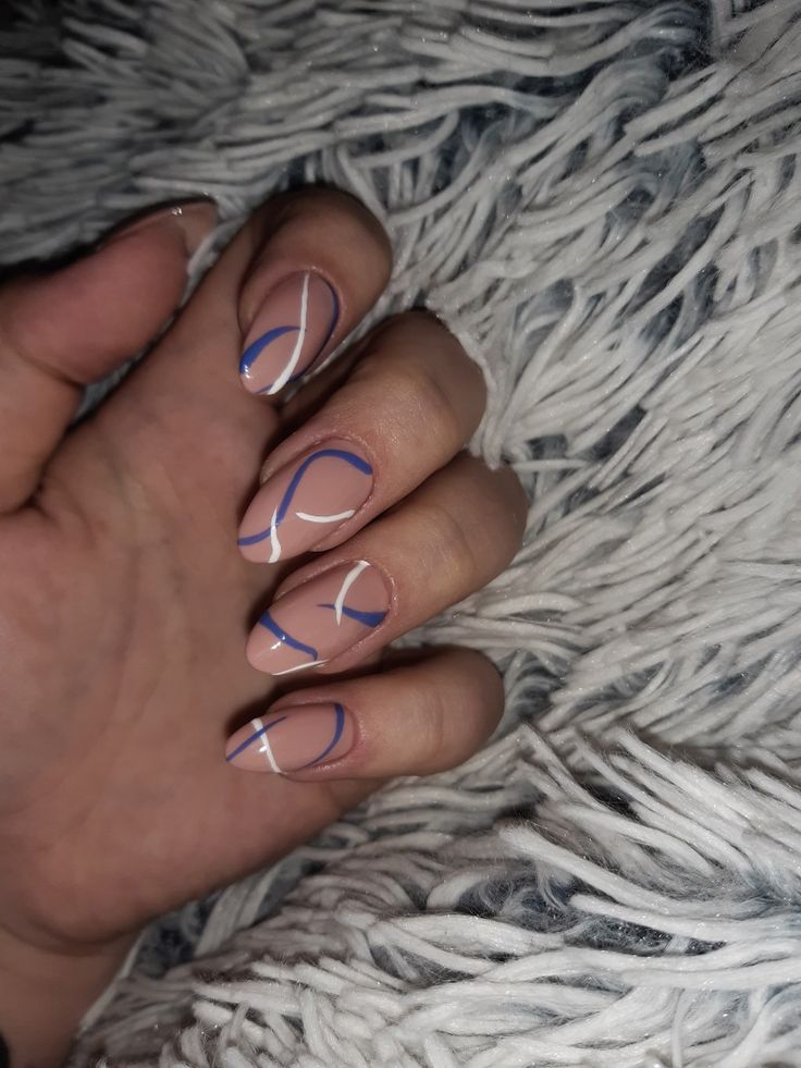 Elegant Nail Design with Nude Base and Artistic Blue and White Lines