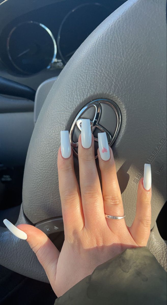 Elegant Chic White Nail Design with Subtle Pink Accents