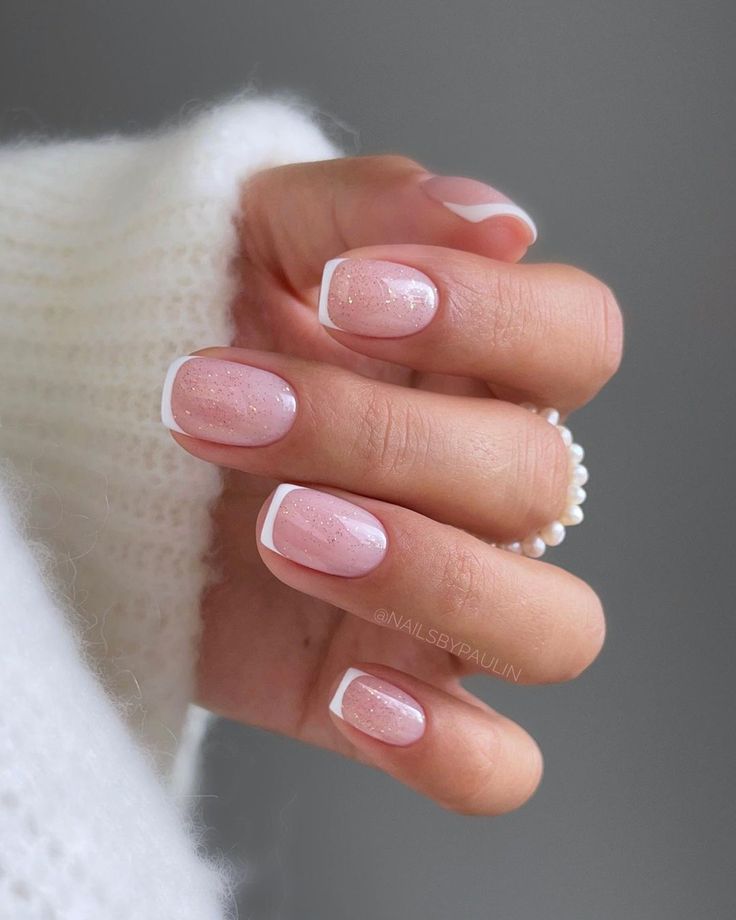 Elegant Soft Pink Nail Design with White Tips and Shimmer for Any Occasion