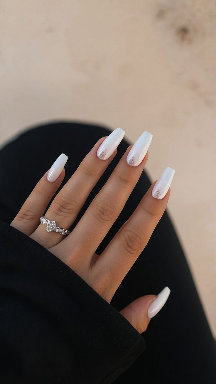 Chic Elegant White Almond-Shaped Nails with Subtle Glitter for Any Occasion