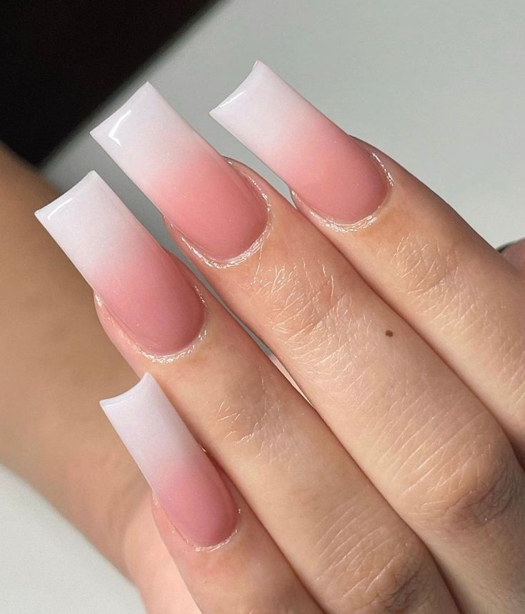 Chic Ombre Nail Design: Light Pink to White Gradient on Long Square Nails.