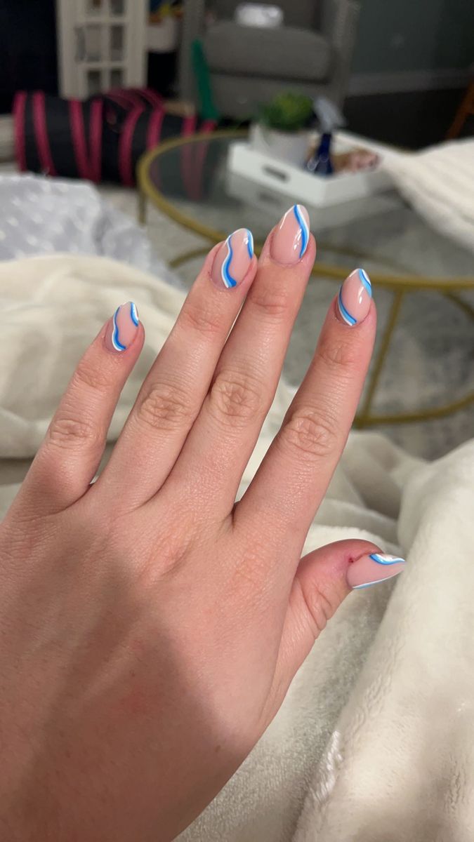 Chic Nude and Wavy Blue Nail Design for a Modern Statement.