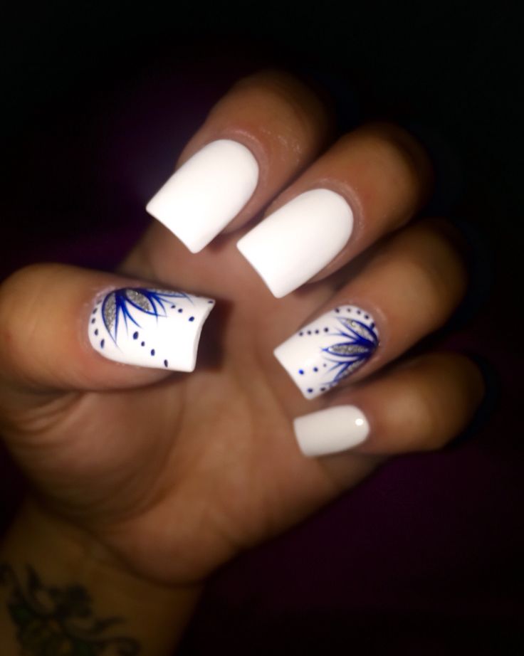 Chic White and Blue Floral Nail Design: A Sophisticated Touch for Any Occasion.