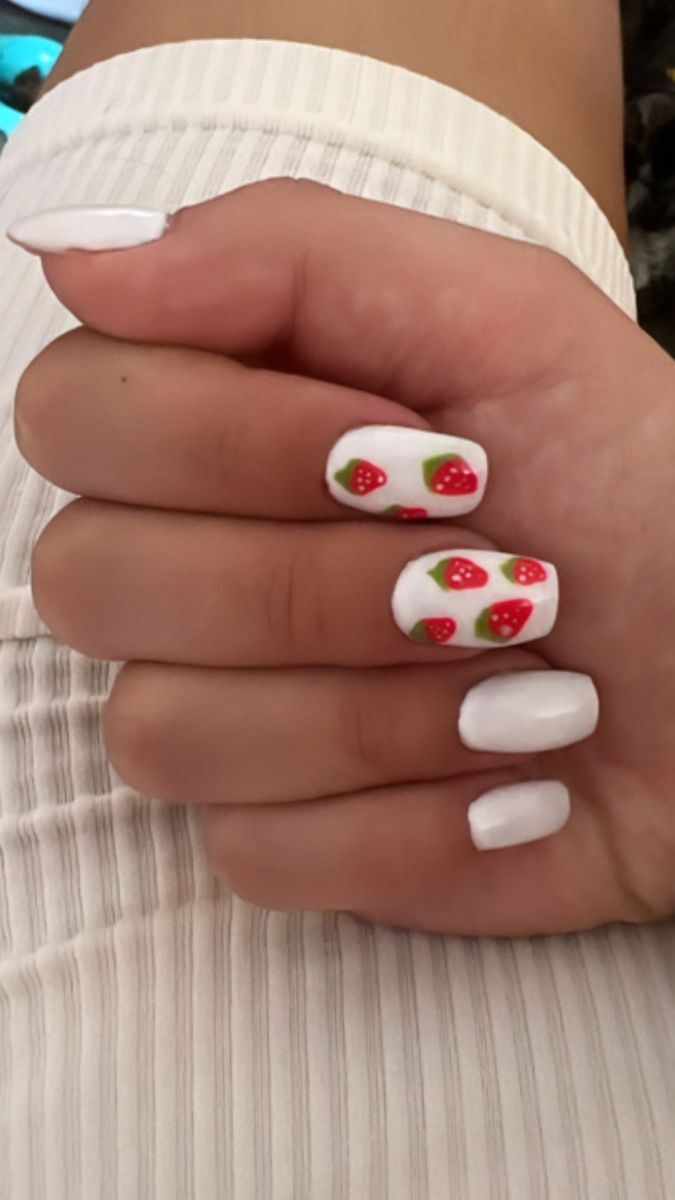 Vibrant Strawberry Nail Art with White Polish: A Cheerful Summer Design.