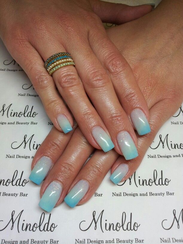 Elegant Gradient Nail Design in Soft Blue and Sparkling White.