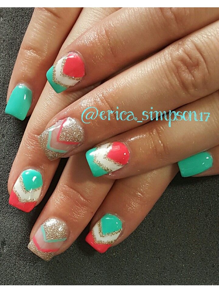 Bold Geometric Nail Design in Teal, Coral, and Gold with Sparkly Accents.