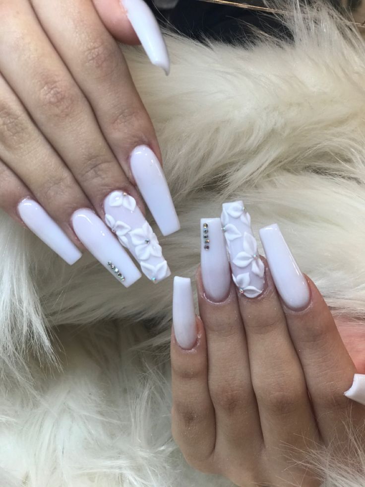 Sophisticated Elegant White Nail Design with 3D Floral Accents and Glossy Finish.