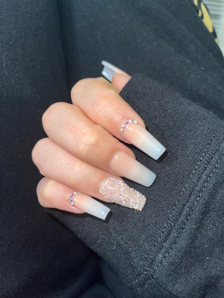 Chic Ombre Nail Design with Sparkling Accents and Elegant Gradient Tips