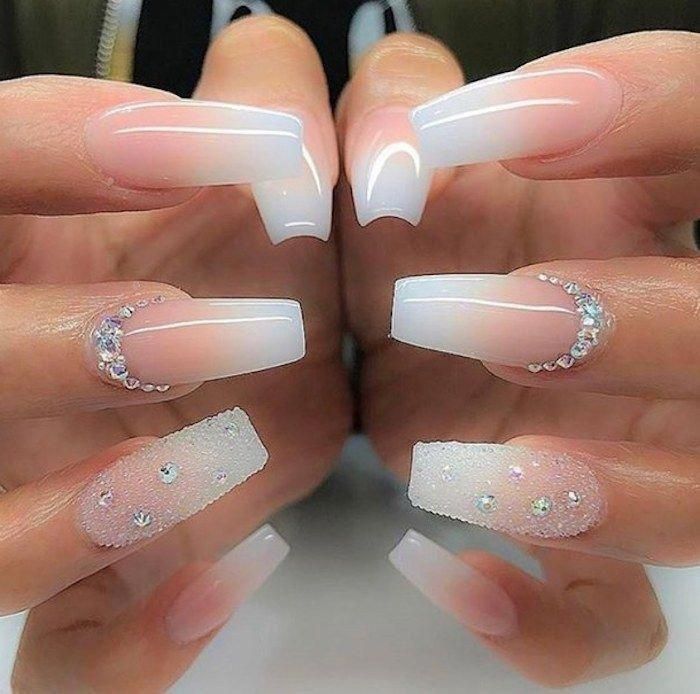 Glamorous Ombre Nail Design with Translucent Pink, Glossy Finish, and Rhinestone Embellishments