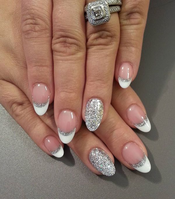 Chic and Sophisticated Elegant French Tip Nail Design with Sparkling Silver Accents and Bold Glitter Contrast.