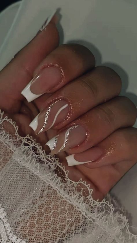 Sophisticated Elegant Nail Design: Natural Base with Classic French Tips and Subtle Glitter Accents